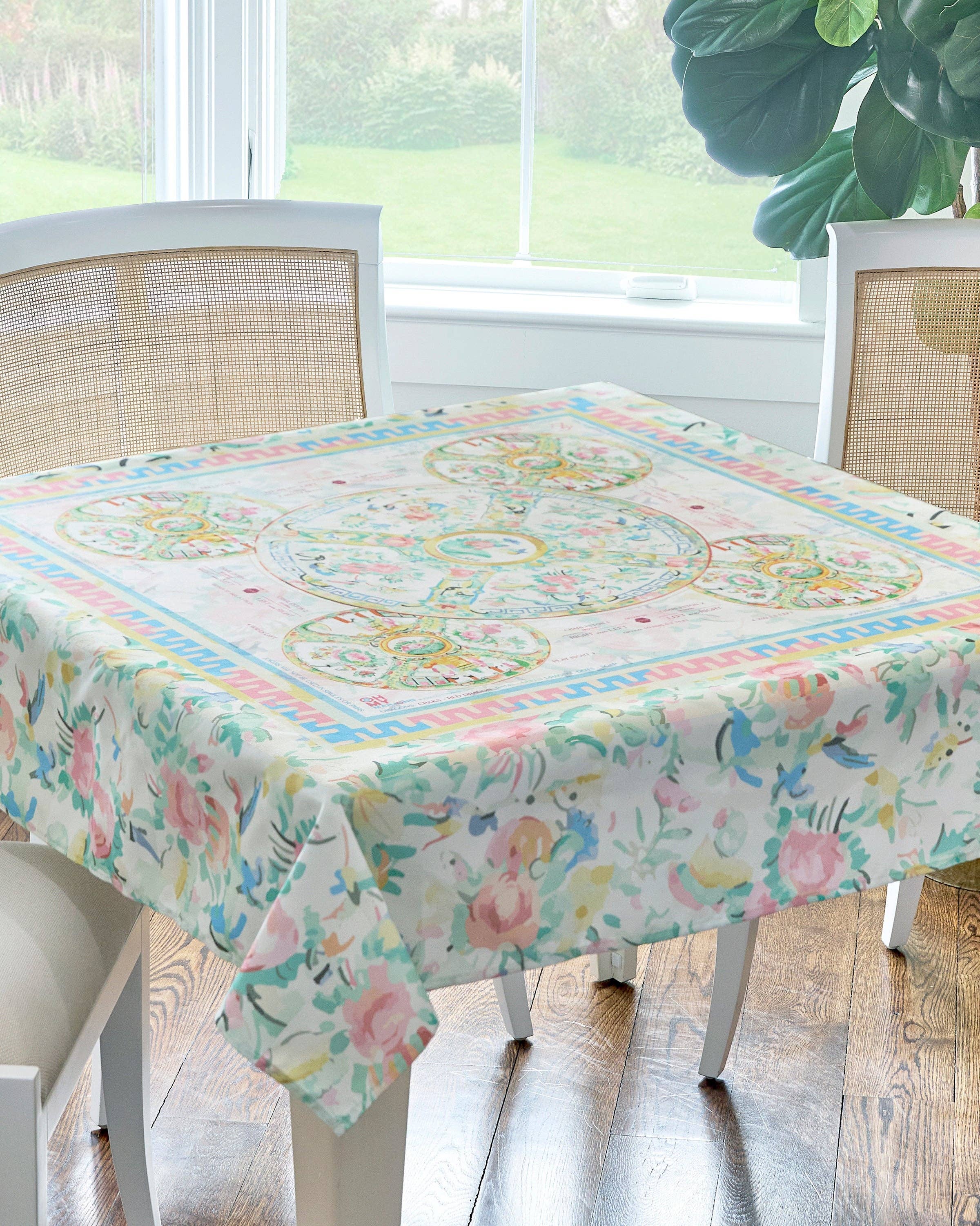 Tablecloth with floral and butterfly design on a dining table